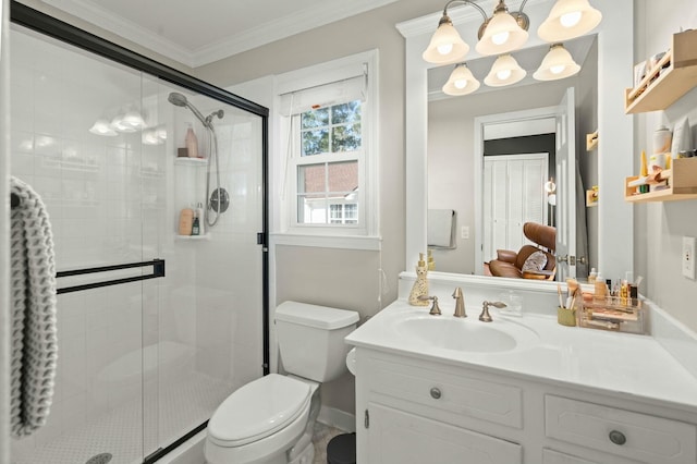 bathroom featuring a shower stall, vanity, toilet, and crown molding