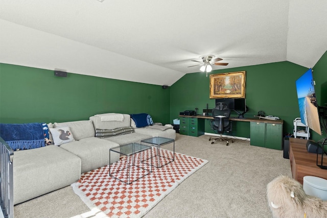 living room featuring a ceiling fan, carpet flooring, and vaulted ceiling