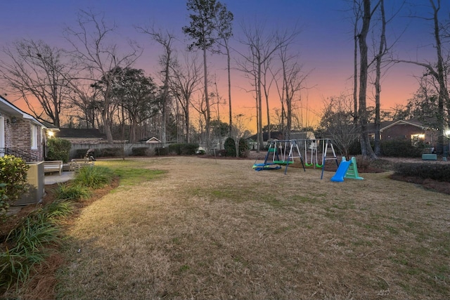 exterior space featuring playground community and a lawn