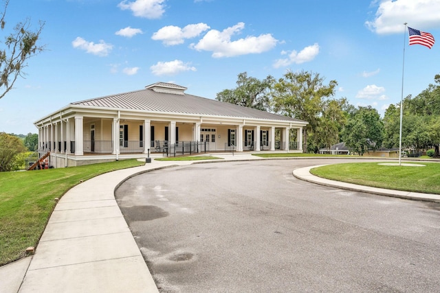 view of building exterior featuring aphalt driveway