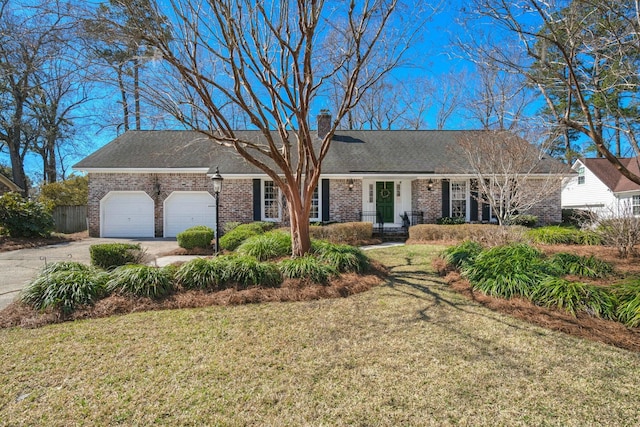 ranch-style home featuring concrete driveway, a front yard, an attached garage, brick siding, and a chimney