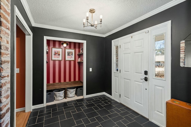 foyer featuring a chandelier, a textured ceiling, and baseboards