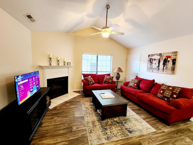 2186 Spoleto Ln, North Charleston, SC 29406 - living area featuring wood finished floors, ceiling fan, a fireplace with flush hearth, and vaulted ceiling