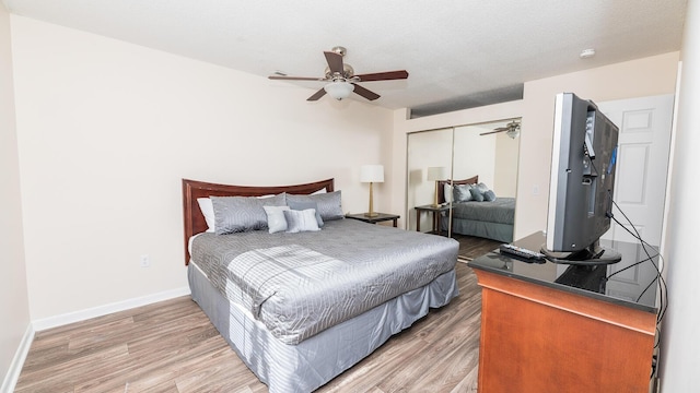 2186 Spoleto Ln, North Charleston, SC 29406 - bedroom with light wood finished floors, a closet, and a ceiling fan