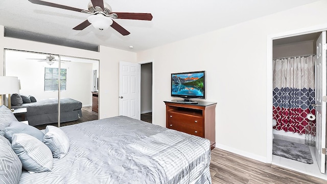 2186 Spoleto Ln, North Charleston, SC 29406 - bedroom featuring wood finished floors, a closet, a ceiling fan, and ensuite bathroom