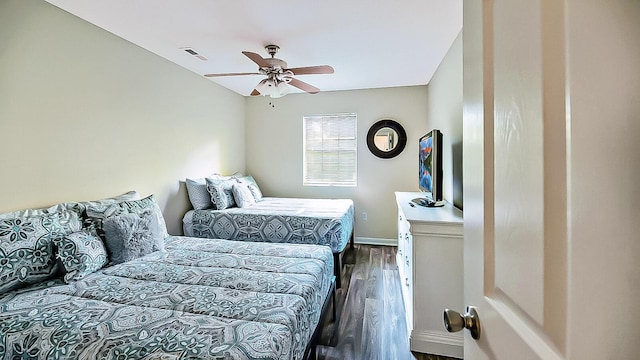 2186 Spoleto Ln, North Charleston, SC 29406 - bedroom with dark wood-style flooring and ceiling fan