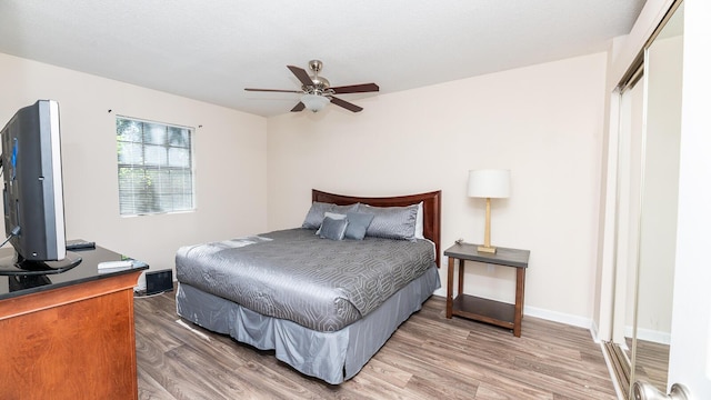 2186 Spoleto Ln, North Charleston, SC 29406 - bedroom with light wood-style flooring and a ceiling fan