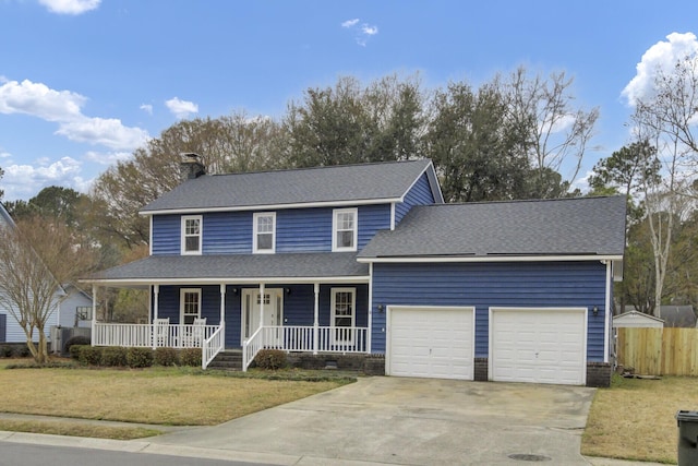 view of front of property featuring a porch, a garage, and a front yard