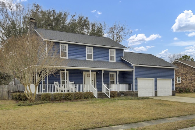 view of front facade with a garage, a porch, and a front yard