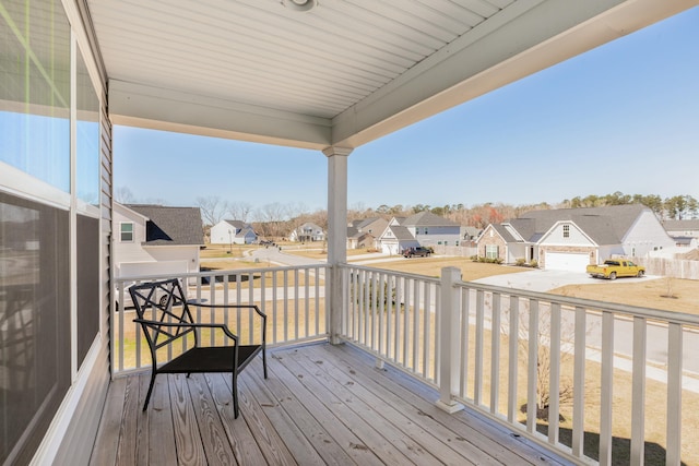 wooden terrace with a residential view