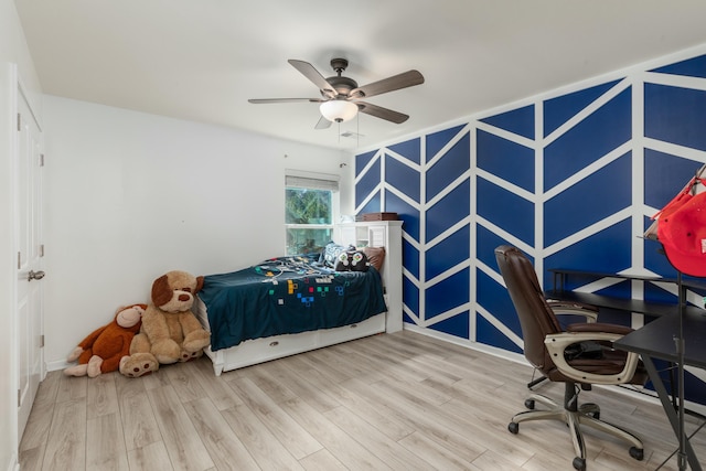 bedroom with wood finished floors