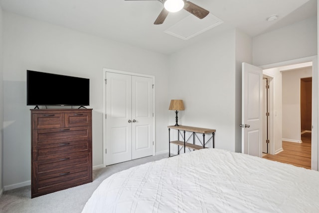 bedroom featuring light carpet, a closet, and ceiling fan