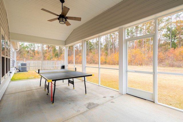 sunroom / solarium with ceiling fan and vaulted ceiling