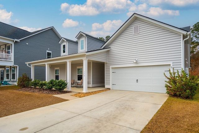 view of front of house with a porch and a garage