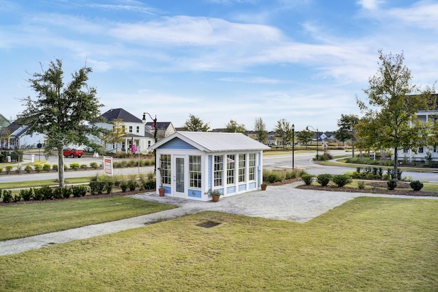 view of property's community with a lawn