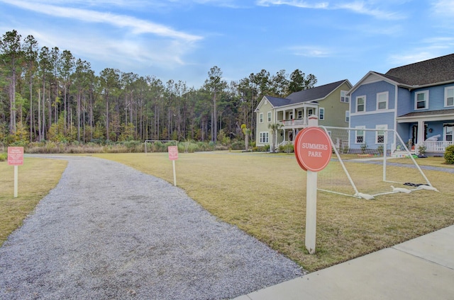 view of home's community featuring a lawn