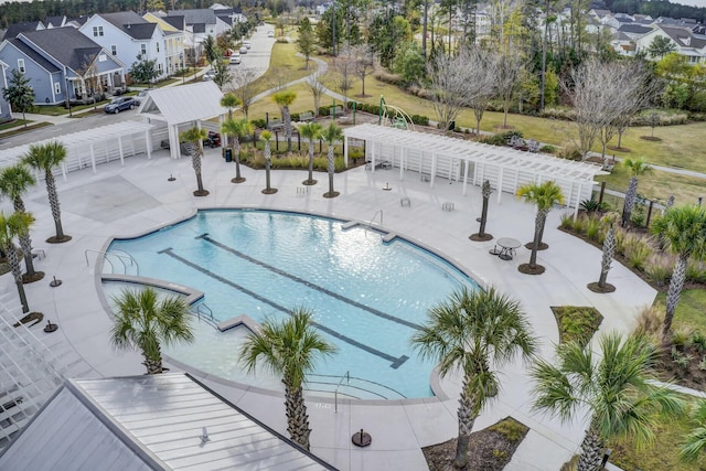 view of swimming pool with a patio