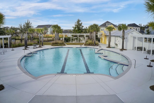 view of swimming pool featuring a pergola and a patio area