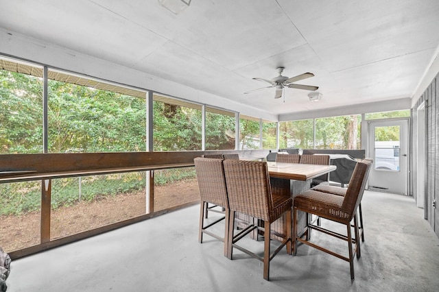 sunroom / solarium with ceiling fan and a healthy amount of sunlight