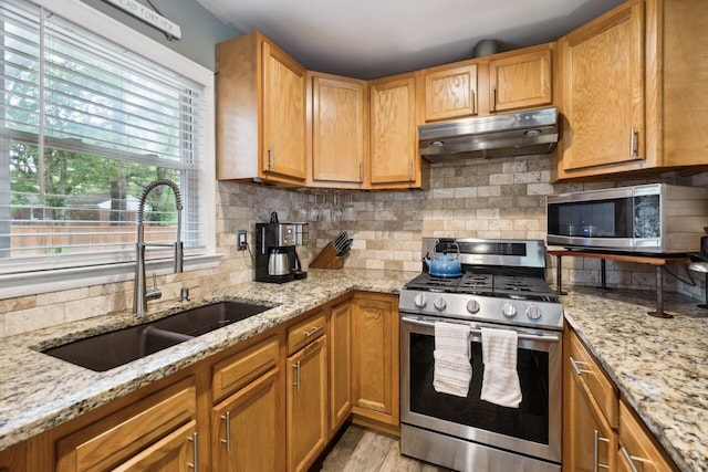 2158 Till Rd, Charleston, SC 29414 - kitchen with appliances with stainless steel finishes, under cabinet range hood, decorative backsplash, and light stone counters