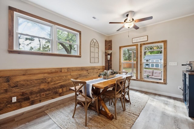 2158 Till Rd, Charleston, SC 29414 - dining area with wood finished floors, a ceiling fan, and ornamental molding