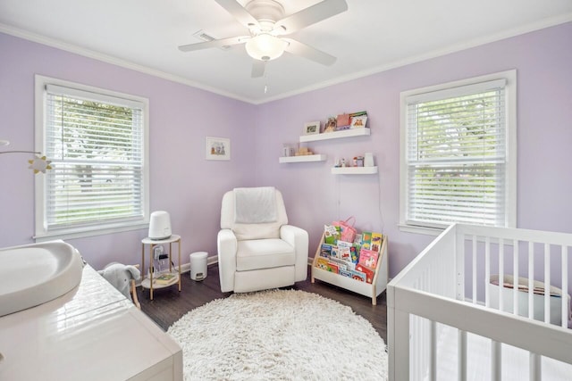 2158 Till Rd, Charleston, SC 29414 - bedroom featuring a nursery area, dark wood-type flooring, ornamental molding, and a ceiling fan