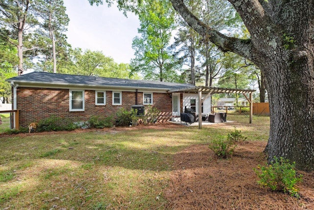 2158 Till Rd, Charleston, SC 29414 - view of front of home featuring a pergola, brick siding, a patio area, and a carport