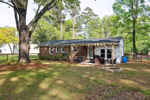 2158 Till Rd, Charleston, SC 29414 - back of property featuring a fire pit, a patio, and brick siding
