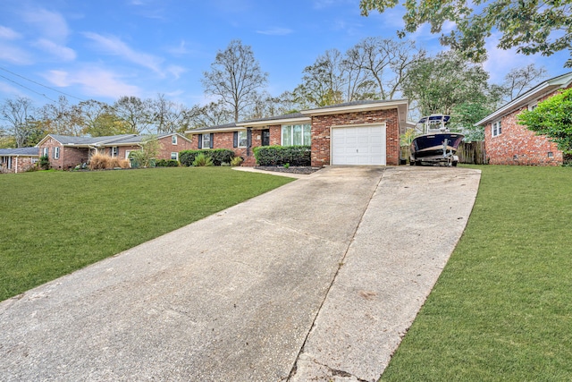 ranch-style house with a garage and a front lawn