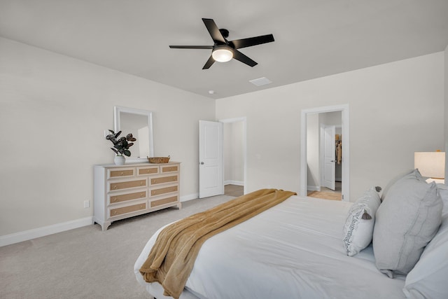 bedroom featuring light colored carpet and ceiling fan