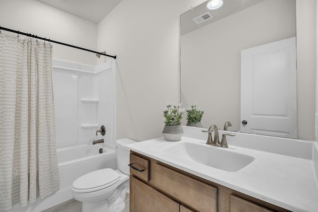 full bathroom with vanity, toilet, and shower / bath combo