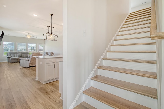299 Lucca Dr, Summerville, SC 29486 - staircase featuring wood finished floors, ceiling fan, and recessed lighting