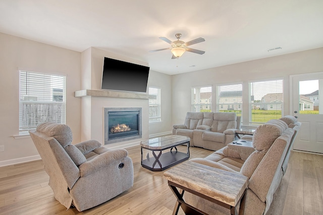 299 Lucca Dr, Summerville, SC 29486 - living area with ceiling fan, a glass covered fireplace, and light wood-type flooring