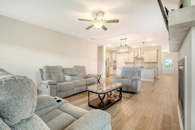 299 Lucca Dr, Summerville, SC 29486 - living room with ceiling fan and light wood-type flooring