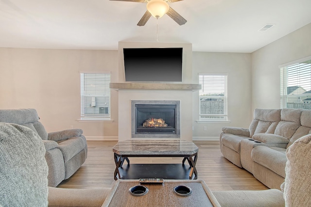 299 Lucca Dr, Summerville, SC 29486 - living room featuring ceiling fan, wood finished floors, and a lit fireplace