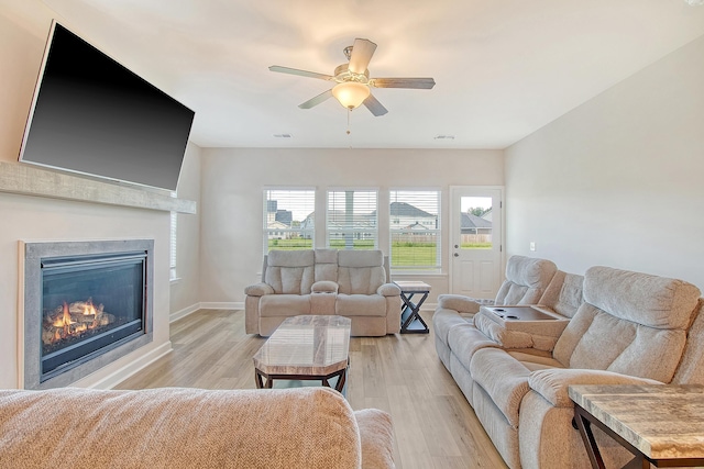 299 Lucca Dr, Summerville, SC 29486 - living room with light wood-style floors, a glass covered fireplace, and ceiling fan