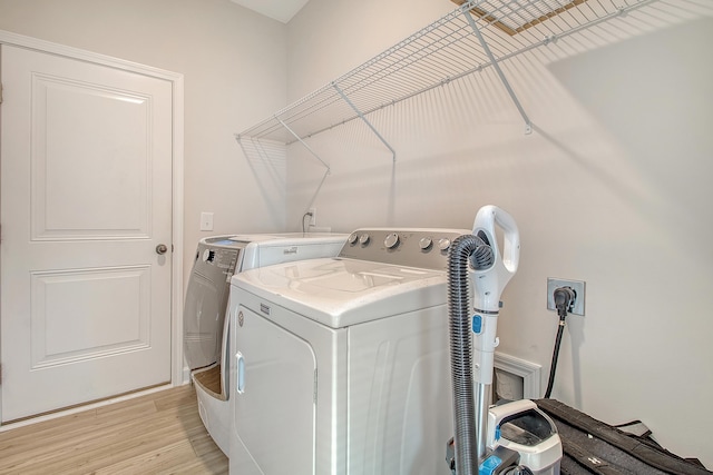 299 Lucca Dr, Summerville, SC 29486 - laundry area with separate washer and dryer and light wood-style flooring