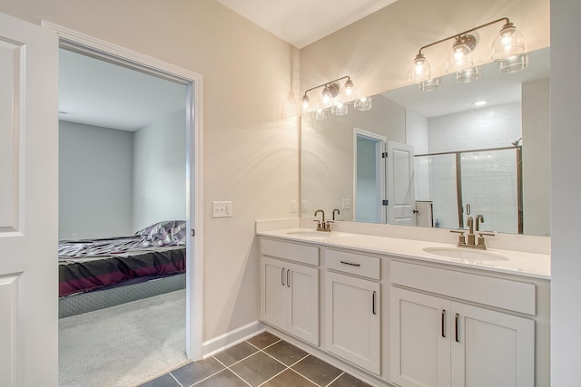 299 Lucca Dr, Summerville, SC 29486 - ensuite bathroom featuring double vanity, a stall shower, and tile patterned floors