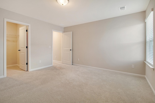 299 Lucca Dr, Summerville, SC 29486 - unfurnished bedroom with a spacious closet, carpet flooring, and a closet
