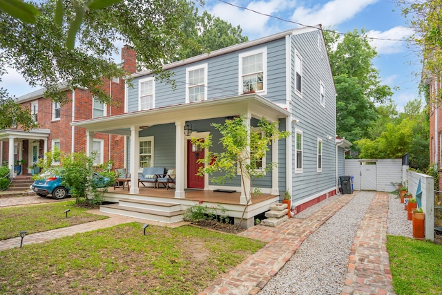 293 Grove St, Charleston, SC 29403 - view of front of house featuring a gate, a chimney, and covered porch