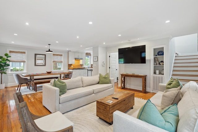 293 Grove St, Charleston, SC 29403 - living room with recessed lighting, ornamental molding, stairway, light wood-type flooring, and baseboards