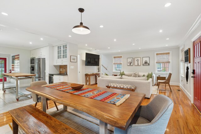293 Grove St, Charleston, SC 29403 - dining room featuring crown molding, recessed lighting, baseboards, beverage cooler, and light wood-style flooring