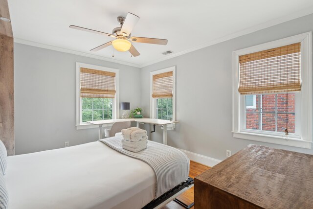 293 Grove St, Charleston, SC 29403 - bedroom featuring wood finished floors, crown molding, baseboards, and ceiling fan