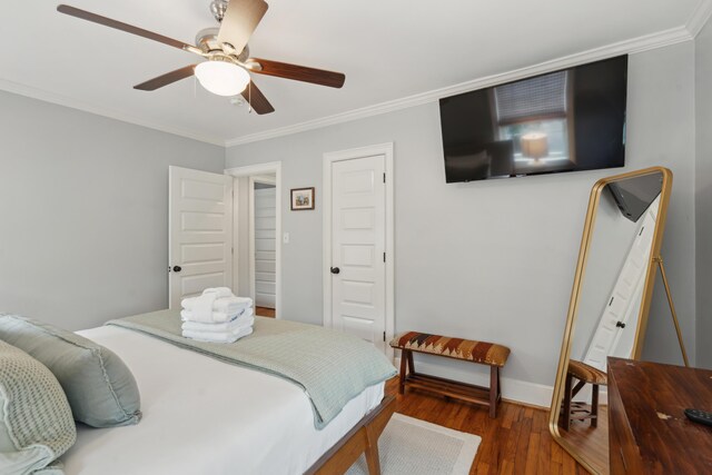 293 Grove St, Charleston, SC 29403 - bedroom featuring wood finished floors, crown molding, baseboards, and a ceiling fan