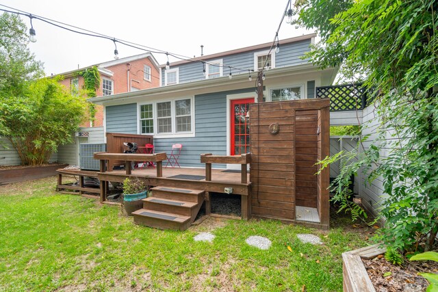 293 Grove St, Charleston, SC 29403 - back of property featuring a lawn, a wooden deck, and central air condition unit
