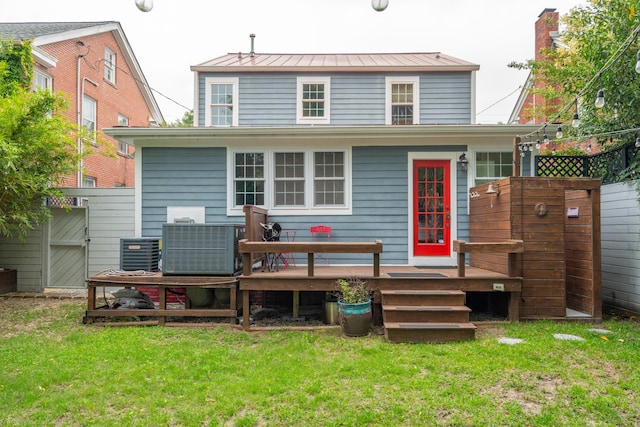 293 Grove St, Charleston, SC 29403 - back of house with a standing seam roof, a deck, a yard, metal roof, and central AC