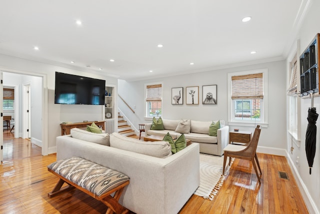 293 Grove St, Charleston, SC 29403 - living room featuring crown molding, recessed lighting, light wood-type flooring, stairway, and baseboards