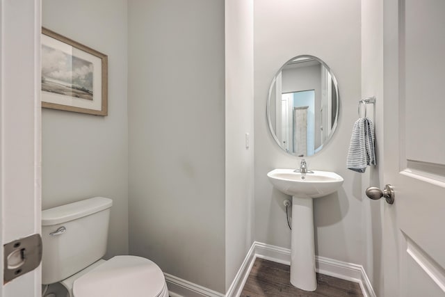 bathroom featuring toilet and hardwood / wood-style flooring