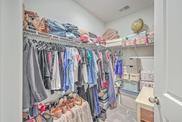 spacious closet with carpet flooring