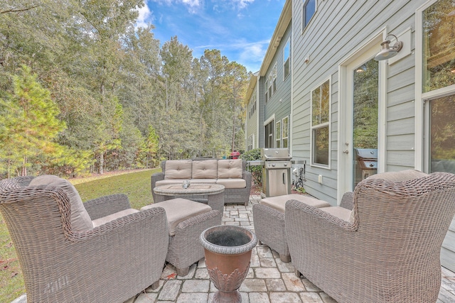 view of patio featuring an outdoor living space and a grill